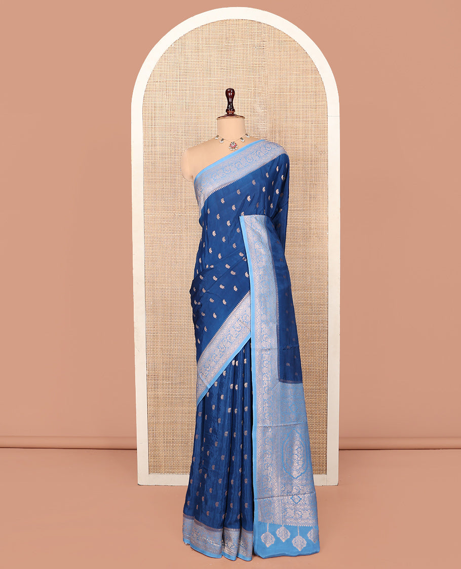 Blue Fancy Crepe Saree, Graced with Buttas, Complemented by a Contrast Floral Border, Intricately Designed Pallu, and a Contrast Blouse