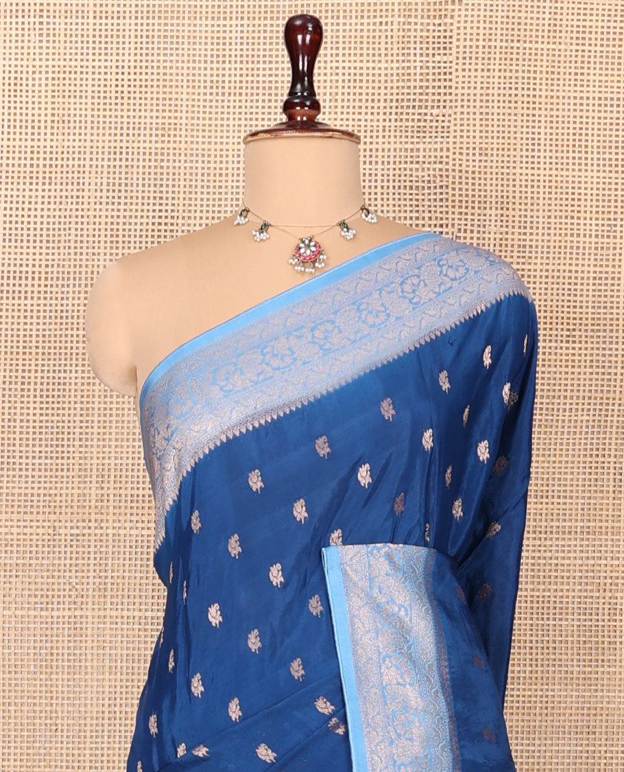 Blue Fancy Crepe Saree, Graced with Buttas, Complemented by a Contrast Floral Border, Intricately Designed Pallu, and a Contrast Blouse