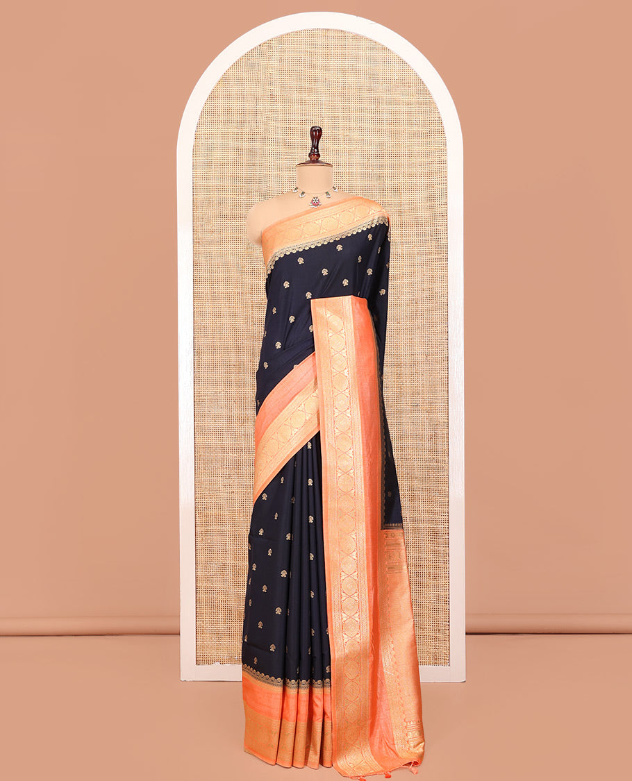 Navy Blue Dupion Silk Saree, Adorned with Buttas All Over Its Body, Complemented by Contrast Traditional Border of Paisleys and Chakram Designs, Intricately Designed Pallu, and Paired with a Contrast Blouse