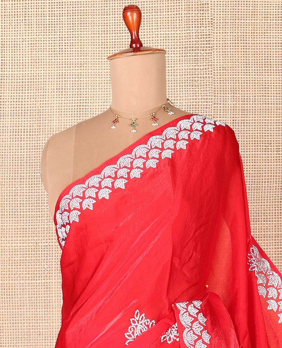 Red stone embroidered motifs designer saree, stone embroidered border
