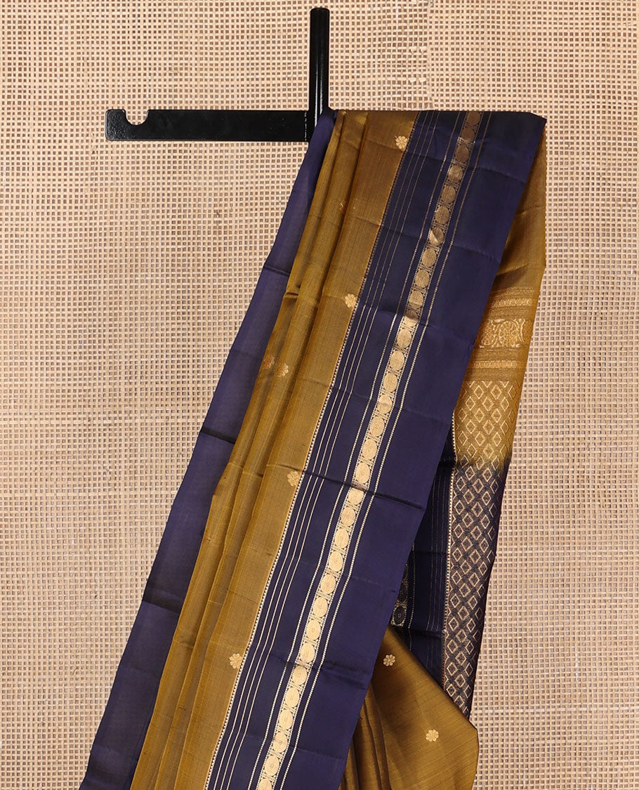 Mehendi green zari buttas Kanchipuram silk saree, contrast jaal pallu & rettai pettu border of rekku, muthu & rudraksham designs