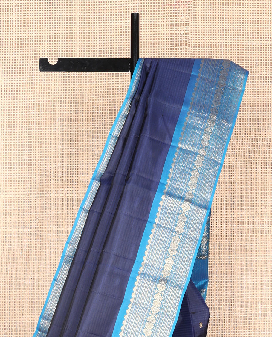 Blue striped & zari buttas silk saree, contrast border of thazampoo rekku,neli,muthu,chakram & jada nagam & zari design pallu