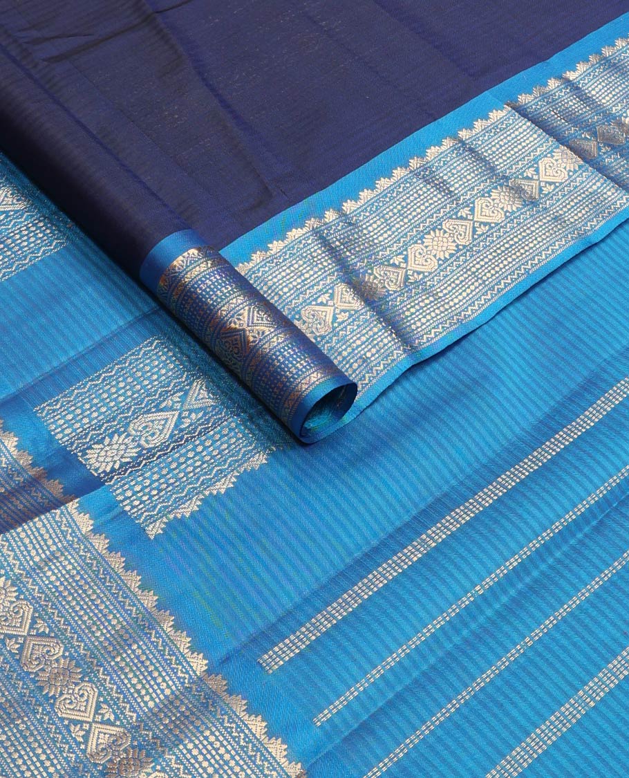 Blue striped & zari buttas silk saree, contrast border of thazampoo rekku,neli,muthu,chakram & jada nagam & zari design pallu
