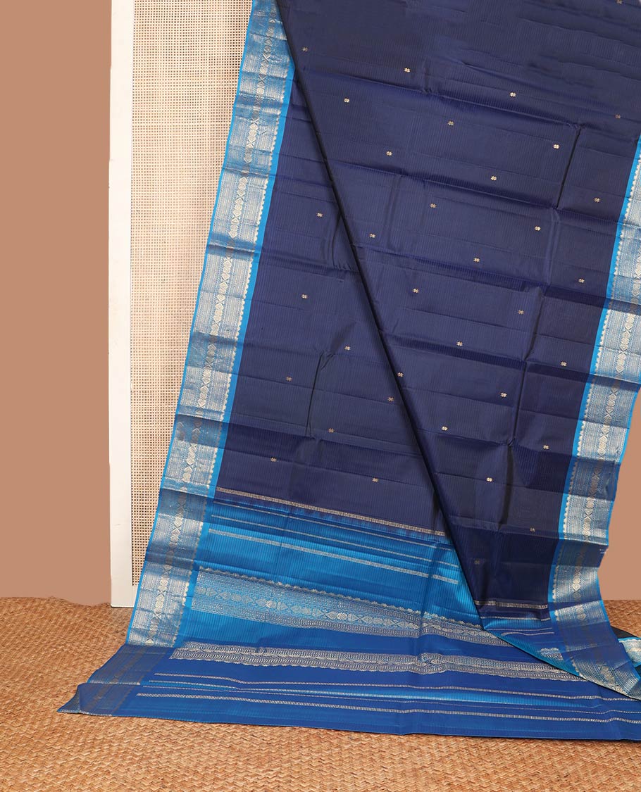 Blue striped & zari buttas silk saree, contrast border of thazampoo rekku,neli,muthu,chakram & jada nagam & zari design pallu