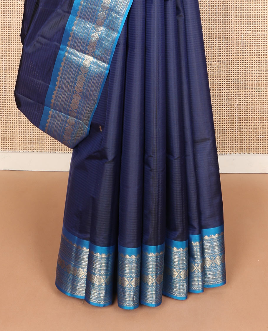 Blue striped & zari buttas silk saree, contrast border of thazampoo rekku,neli,muthu,chakram & jada nagam & zari design pallu