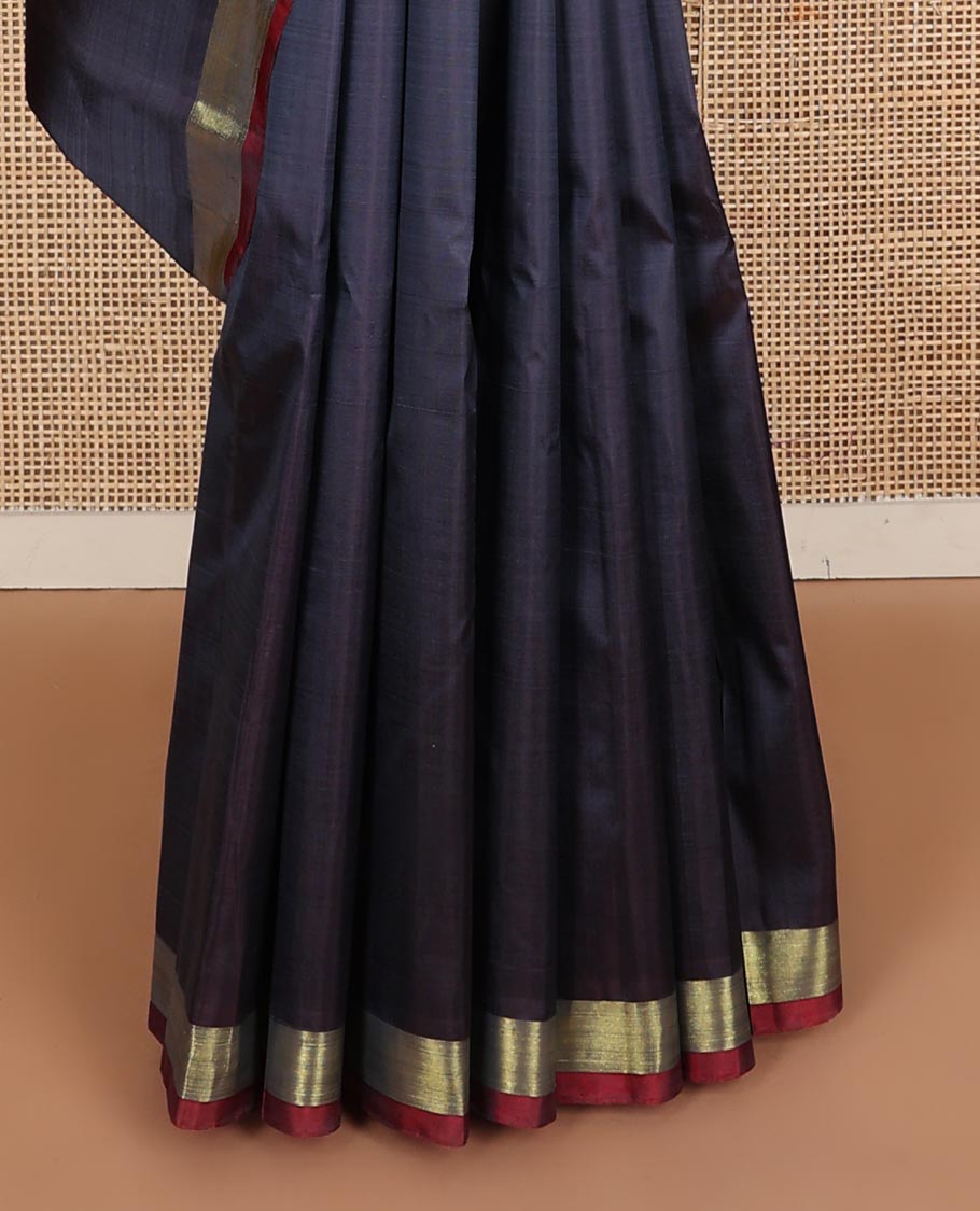 Dark blue zari buttas Kanchipuram silk saree, contrast bavanji border, and floral zari design pallu
