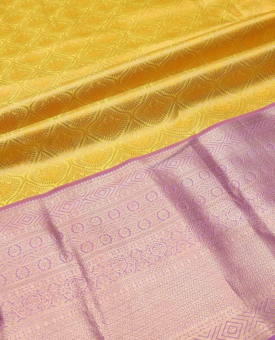 Yellow pure silk half-saree, jacquard skirt, contrast border of thilakam mokku,banaras, mayil kann,cross kamalam, and then kuli kann , contrast zari blouse, and zari design dhavani
