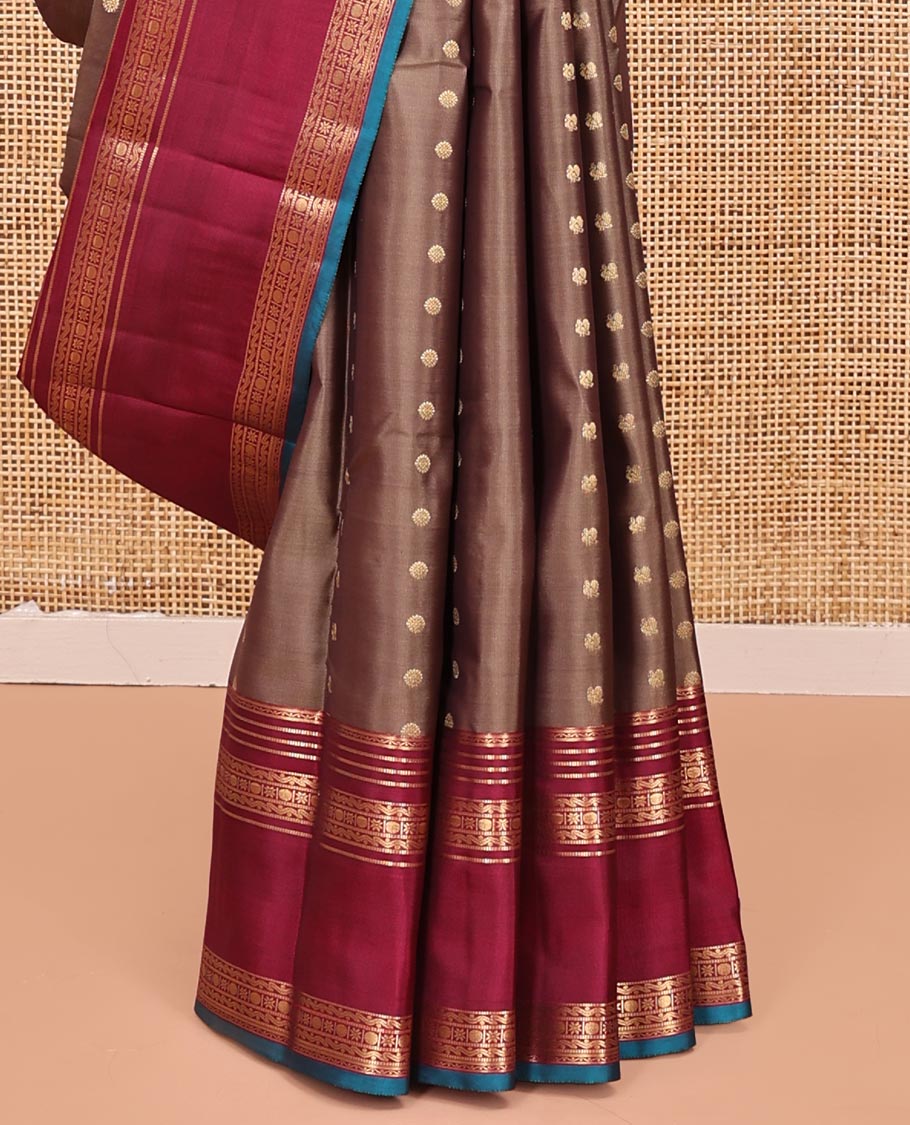 Brown Vasundhara Silk Mix Saree, Enriched with Zari Buttas All Over Its Body, Complemented by Contrast Varisai Pettu Border of Neli, Muthu, Star Kamalam, and Rudraksham Designs, Vanki Design Pallu, and Paired with a Contrast Blouse