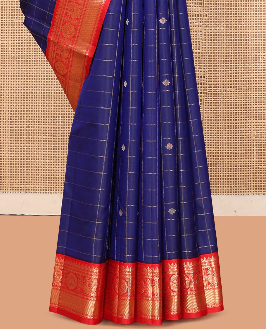 Blue Vasundhara Silk Saree, Adorned with Butta Enclosed Checks, Complemented by a Contrast Border of Mayil Chakram Designs, and a Contrast Blouse