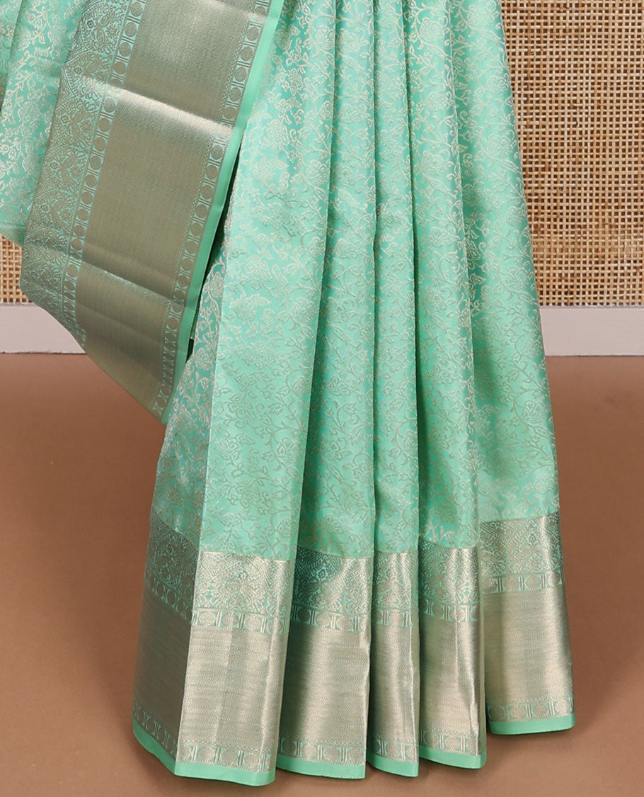 Sea green floral design kancheepuram silk saree with self border of banaras, muthu, paun design & floral pallu
