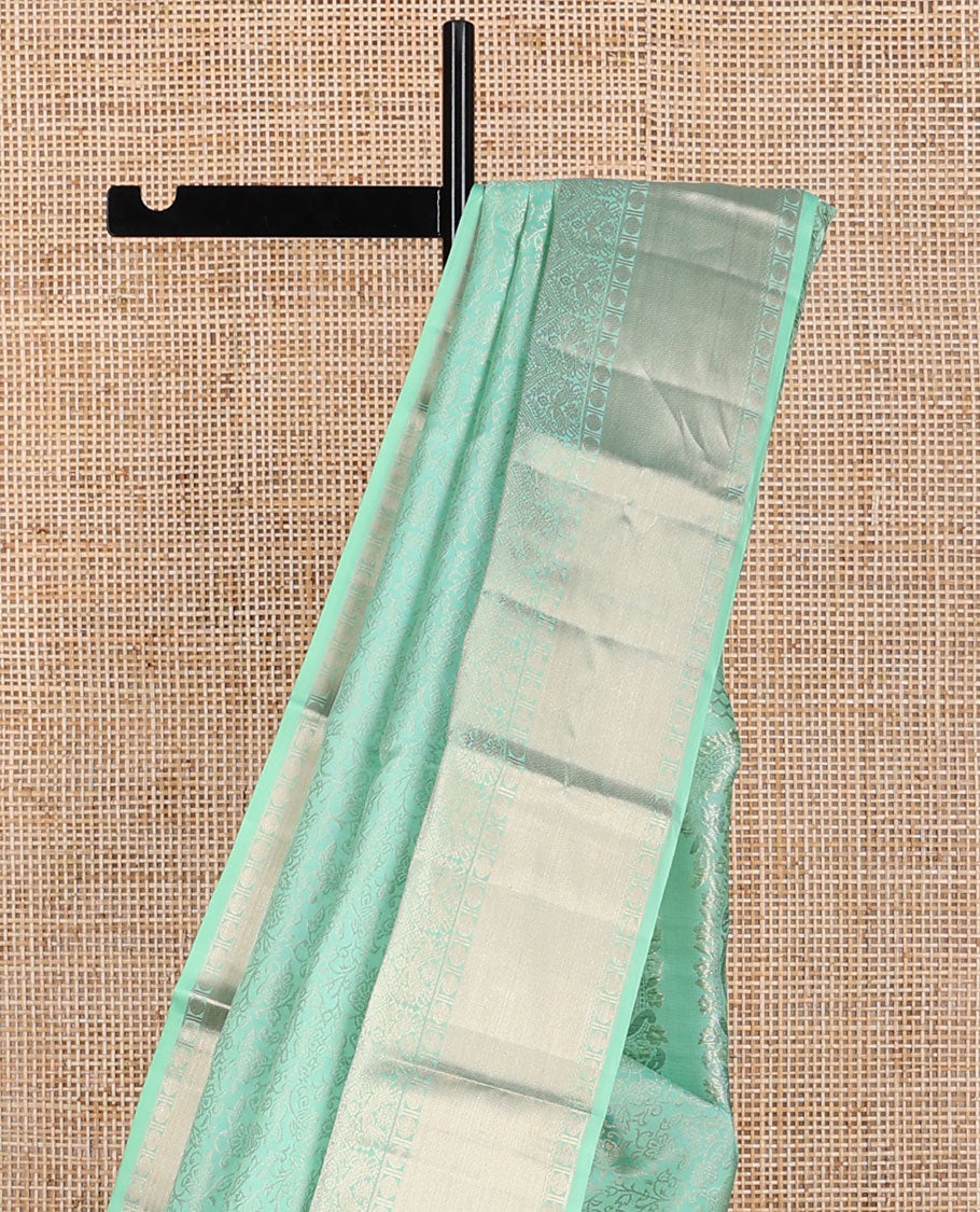 Sea green floral design kancheepuram silk saree with self border of banaras, muthu, paun design & floral pallu