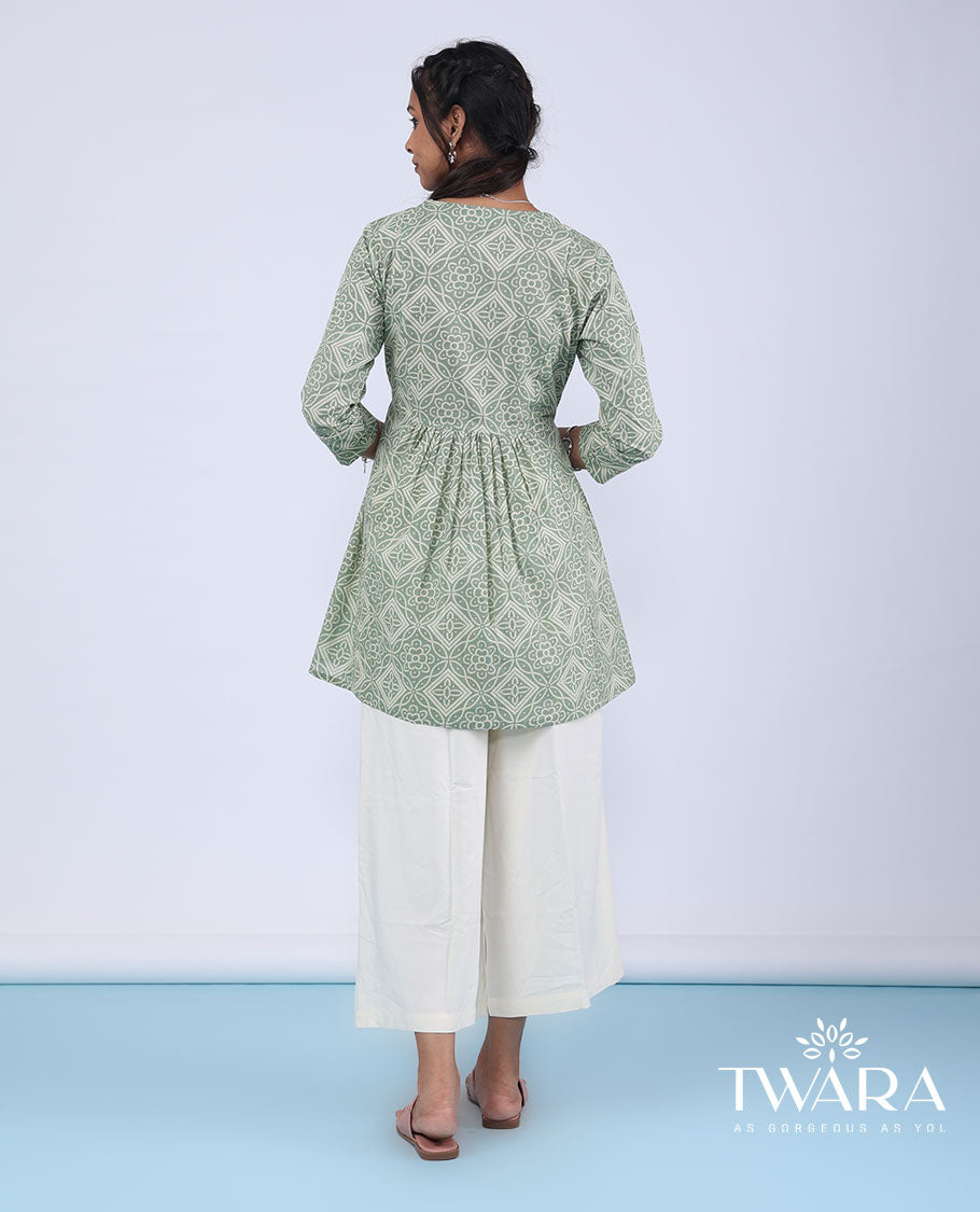 Twara green bandhani-style intricately printed with mirror embroidery 3/4th sleeve tie-up top
