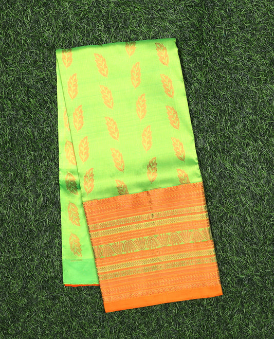 Green navarathna pavadai with leaf-shape buttas, contrast zari border & blouse of traditional zari designs
