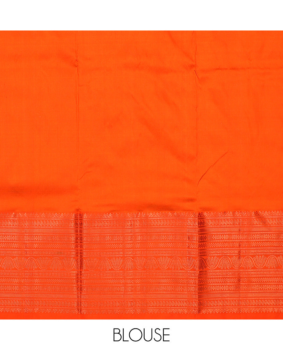 Green navarathna pavadai with leaf-shape buttas, contrast zari border & blouse of traditional zari designs