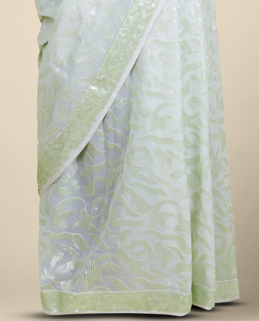 Pastel green georgette saree with floral vine designs sequins embroidered all over its body & pallu, sequins work border