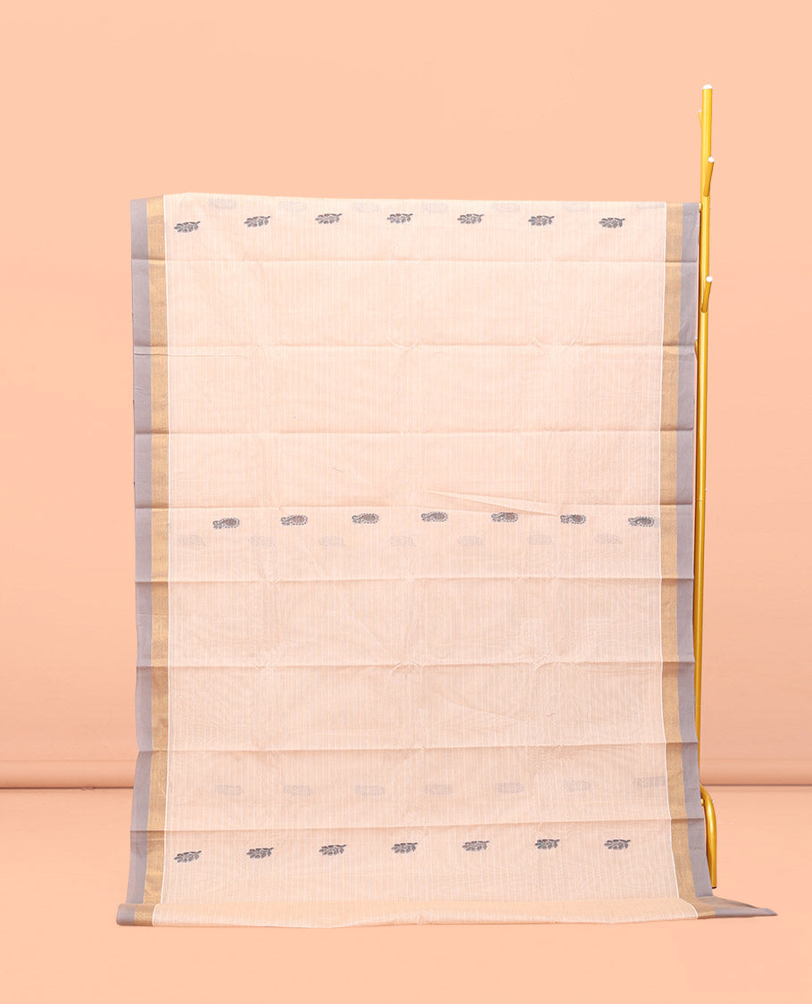 Cream Kanchi Cotton Saree, Bedecked with Buttas and Stripes All Over Its Body, Complemented by Contrast Border, Ogee Patterned Pallu, and Paired with a Matching Blouse