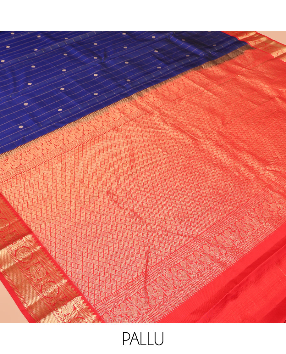 Blue Vasundhara Silk Saree, Adorned with Butta Enclosed Checks, Complemented by a Contrast Border of Mayil Chakram Designs, and a Contrast Blouse