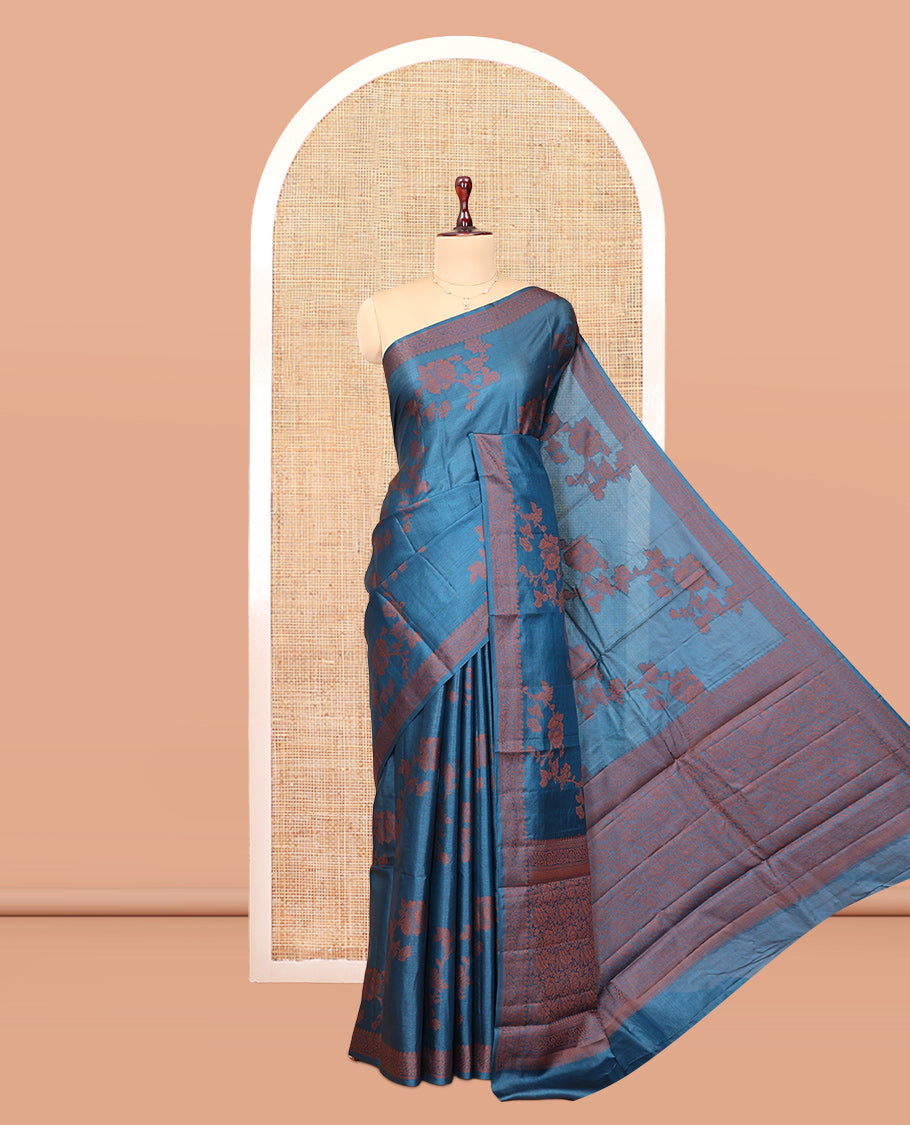 Blue Tussar Silk Saree Features Floral Designs, Sparsely Woven Zari Border, Intricately Designed Pallu, and a Matching Blouse