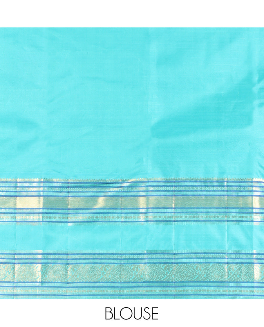 Tomato Red and Blue Vasundhara Silk Saree, Subtly Sparkled With Pattu Nool Kattam On Its Body, Complemented by Contrast Rettai Pettu Border of Salngai, Muthu, Neli, Rudraksham, and Dhavana Kodi Designs, Grand Pallu and Paired with a Contrast Blouse