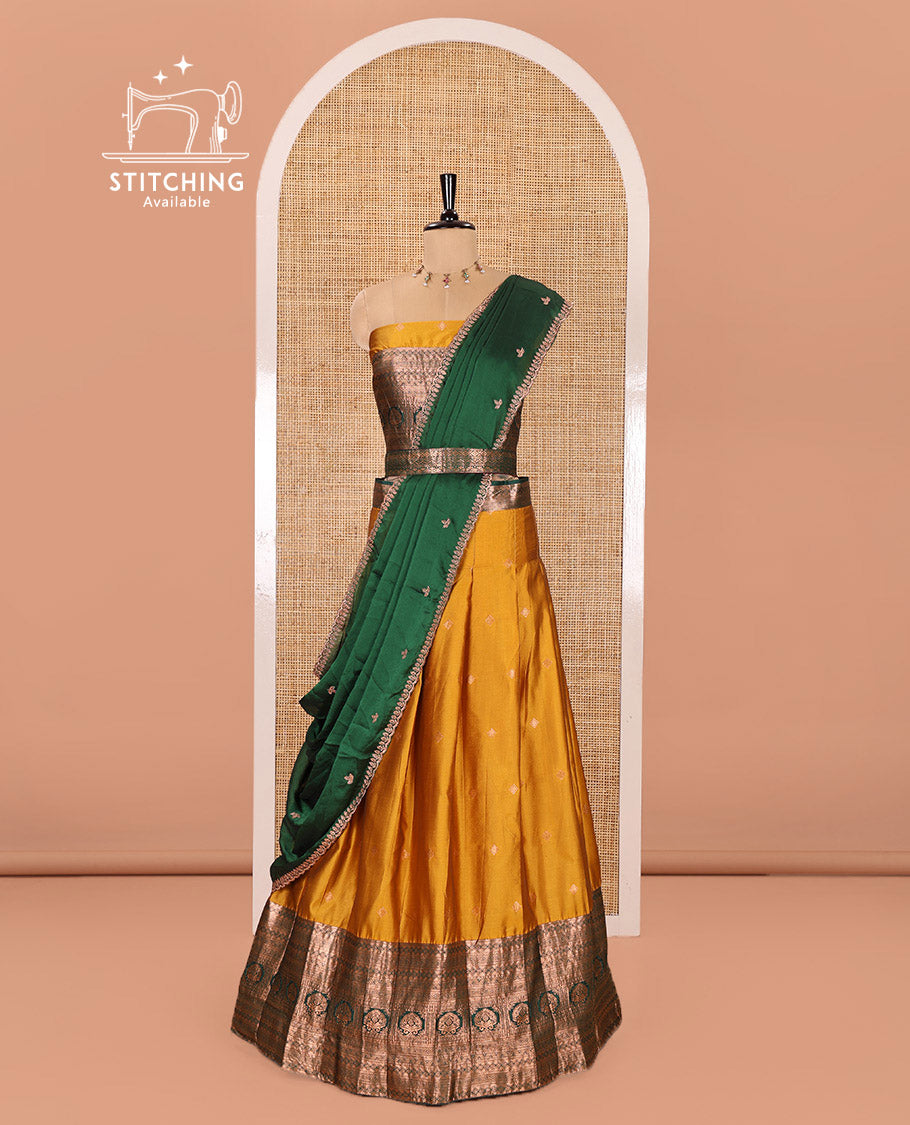 Yellow and Green Semi-Banarasi Half-Saree Prettified with Zari Buttas on Its Skirt, Complemented by a Contrast Traditional Zari Design Steeped Border, Paired with a Matching Blouse, and a Satin Georgette Embroidered Scallop Dhavani