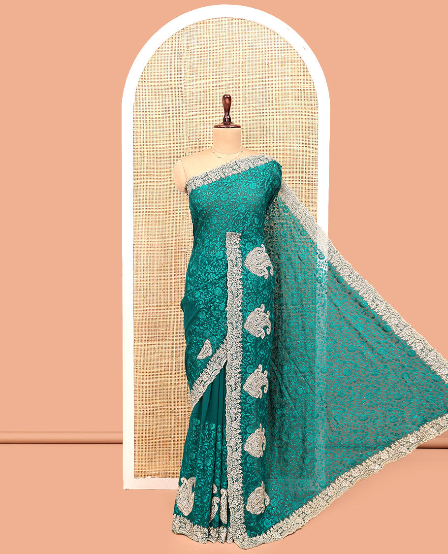 Green Designer Saree, Spotlighted with Floral Vine Embroidery, a Scallop Embroidered Border, and a Matching Blouse