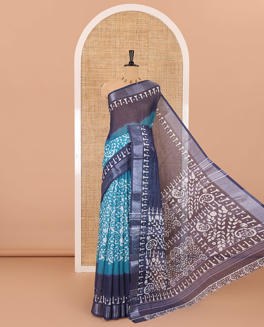 Blue batik style paisleys printed linen cotton saree, contrast batik printed with zari border, batik paisleys printed pallu, and a contrast printed blouse