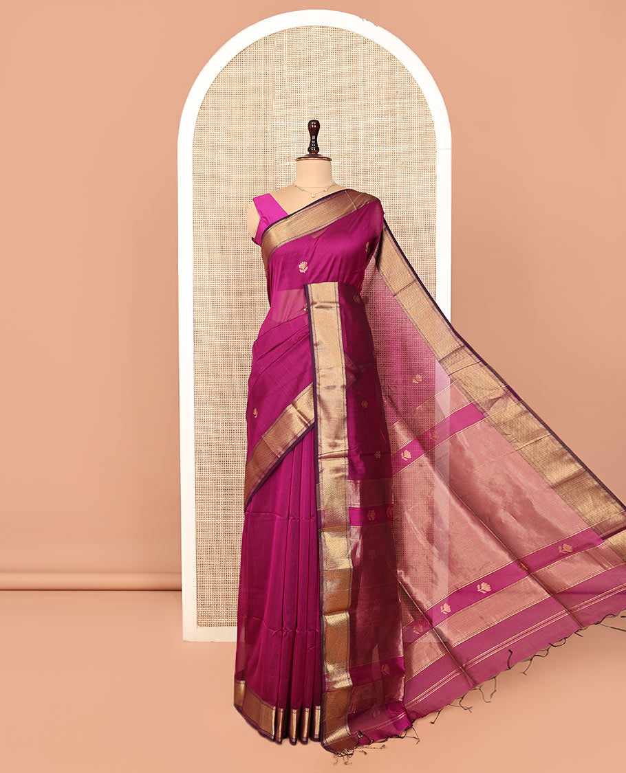 Purple Maheshwari Cotton Saree, Charmingly Accented with Floral Buttas All Over Its Body, Highlighted by Traditional Zari Border, Pallu Steeped with Gleaming Zari Stripes, and Paired with a Matching Blouse