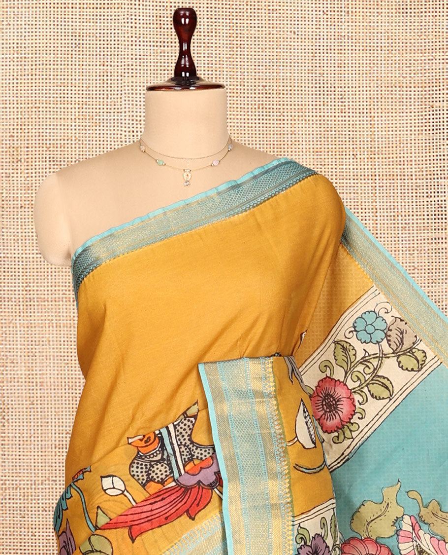 Gold Kalamkari Silk Saree, Impeccably Styled with Floral Vine and Human Motifs Print, a Contrast Traditional Zari Border, Pallu Features Peacocks, and a Contrast Blouse