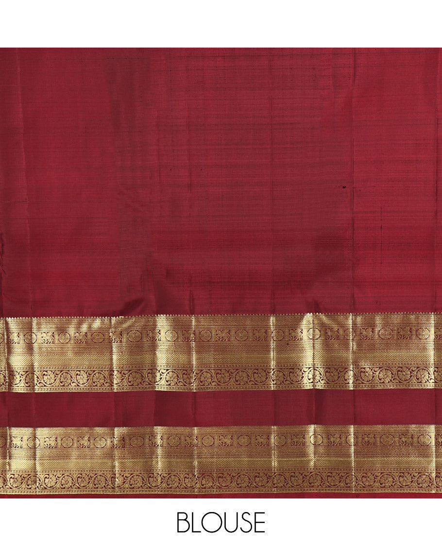 Green Kanchipuram Silk Saree, Woven with Zari Buttas All Over Its Body, Complemented by a Contrast Border of Rekku, Muthu, Kuthirai, Chakram, Mayil Kann, and Kodi Visiry Designs, Grand Jaal Pallu, and Paired with a Contrast Blouse