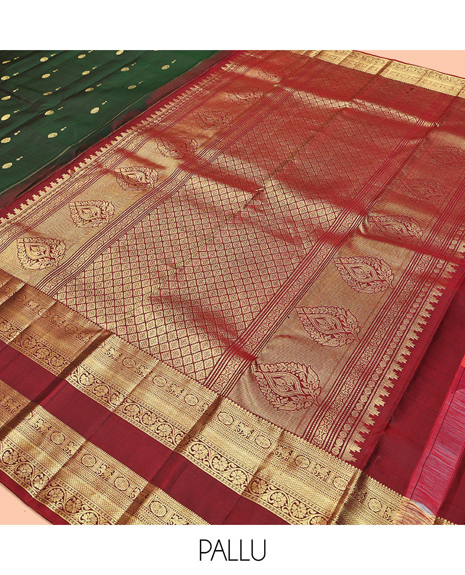 Green Kanchipuram Silk Saree, Woven with Zari Buttas All Over Its Body, Complemented by a Contrast Border of Rekku, Muthu, Kuthirai, Chakram, Mayil Kann, and Kodi Visiry Designs, Grand Jaal Pallu, and Paired with a Contrast Blouse