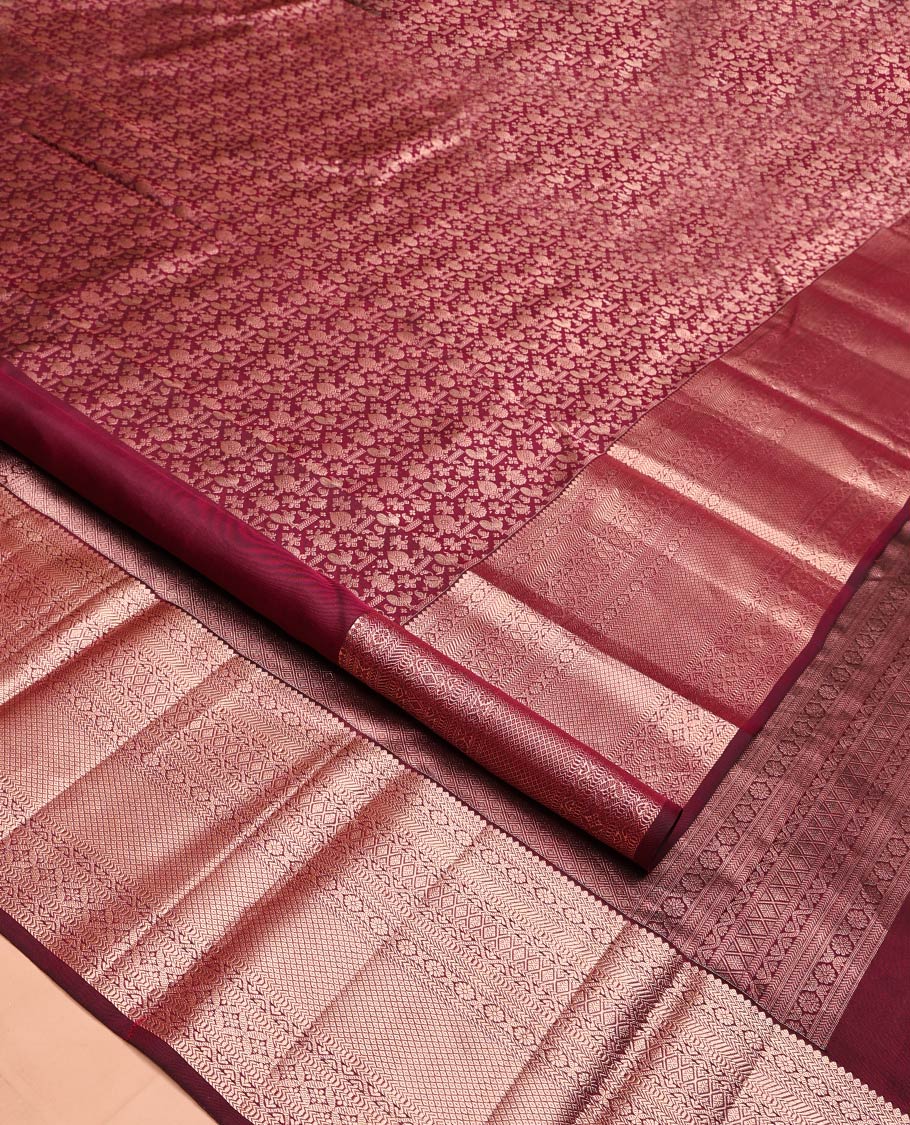 Maroon Kanchipuram Wedding Silk Saree, Elegantly Embellished with Jacquard Design on Its Body, Highlighted by Zari Border of Thilakam Mokku, Kathir, Cross Kamalam, and Mayil Kann Designs, Grand Jaal Pallu, and Paired with a Matching Blouse