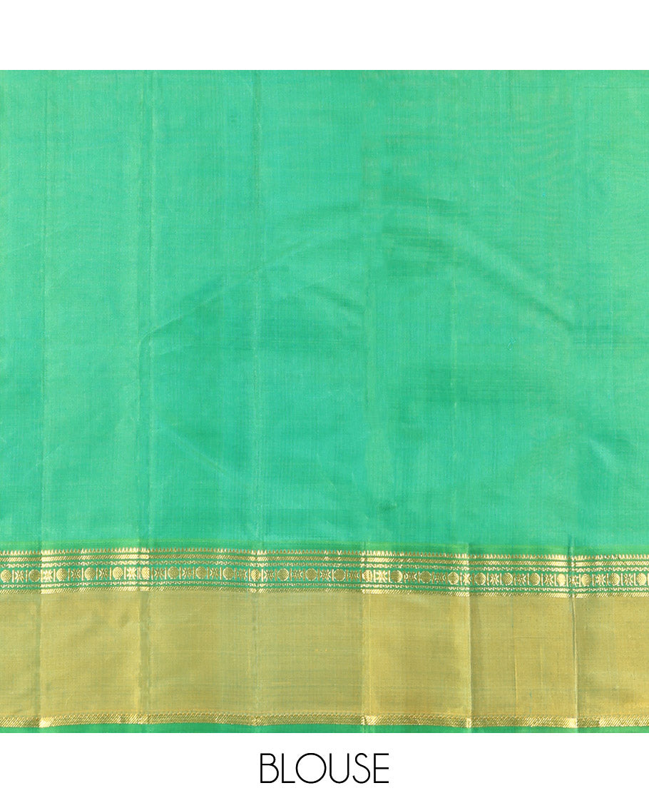 Blue Plain Kanchipuram Silk Saree, Complemented by a Contrast Rettai Pettu Border of Rekku, Banaras, Rudraksham, and Star Designs, Zari Striped Pallu, and Paired with a Contrast Blouse