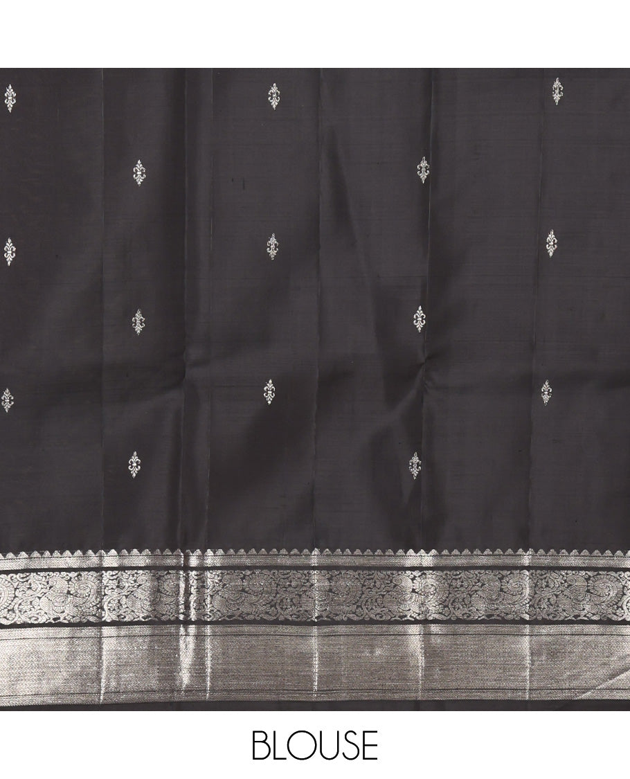 Black Kanchipuram Silk Saree, Dazzled with Zari Buttas All Over Its Body, Highlighted by Zari Border of Rekku, Kathir, Vanki, and Mayil Designs, Pallu of Jaal Design, and Paired with a Matching Blouse