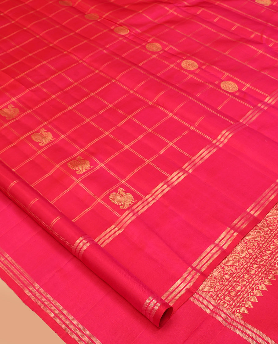 Pink Kanchipuram Silk Saree, Adorned with Mayil-Chakram Butta Enclosed Checks, a Zari Bodi Border, Zari Grand Pallu, and a Matching Blouse