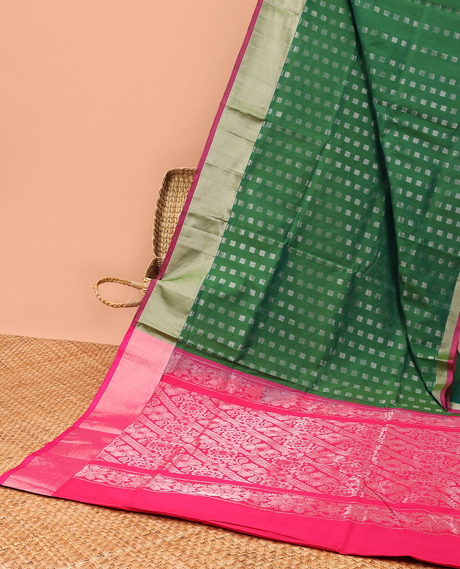 Green kupadam cotton saree with buttas, plain border & contrast pallu of intricate zari designs