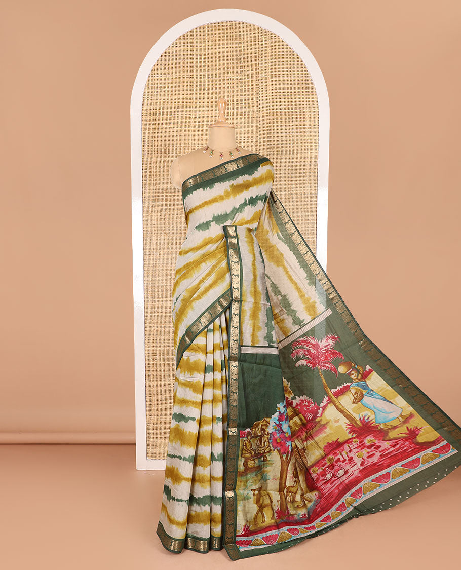 Mehendi green shibori printed muslin cotton saree, contrast peacock zari border, village scenery printed pallu, and a contrast polka dotted zari border blouse