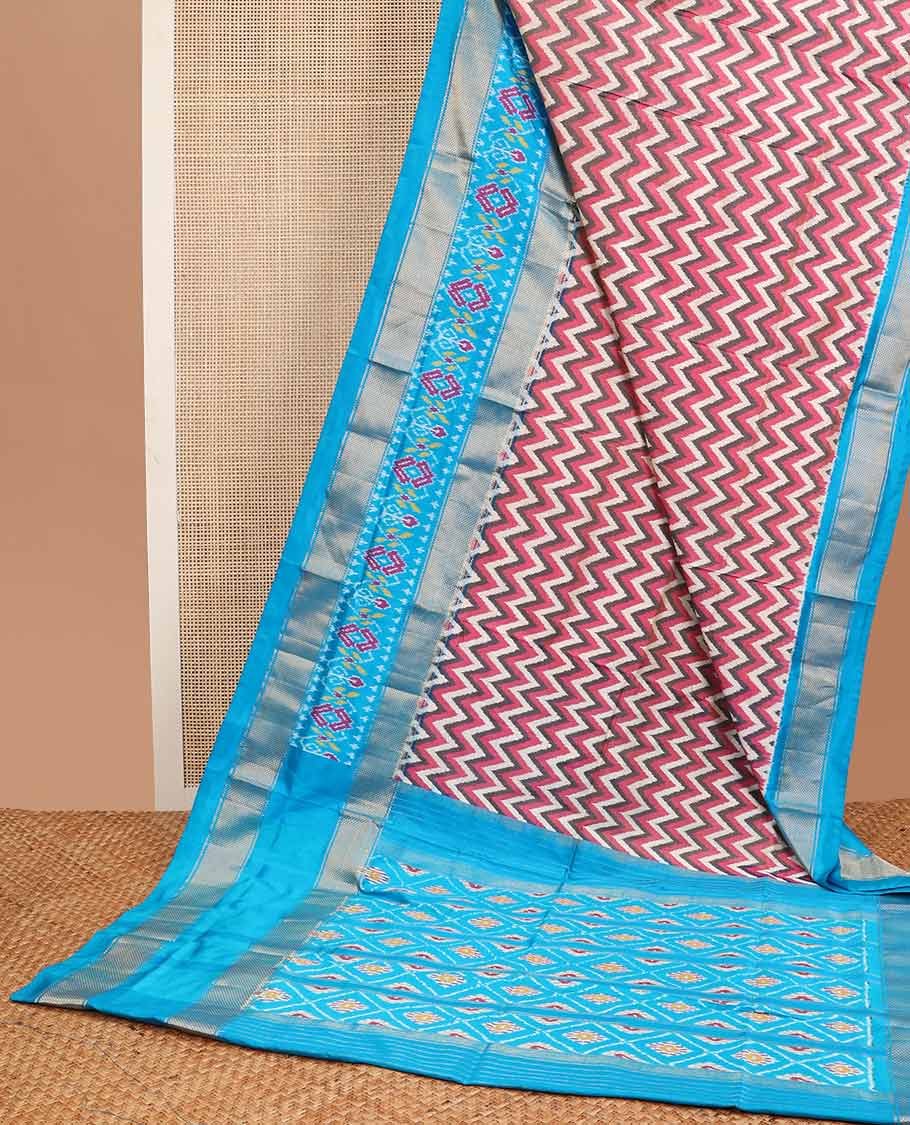 Multi- color chevron design ikkat sareee with contrast zari, floral design border & floral enclosed with checked design pallu