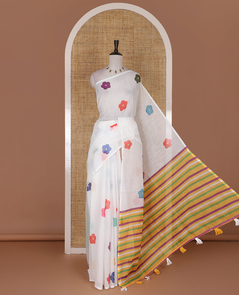 Borderless White colorful five-petal flower motifs printed linen cotton saree, multi-color striped pallu, and contrast printed blouse