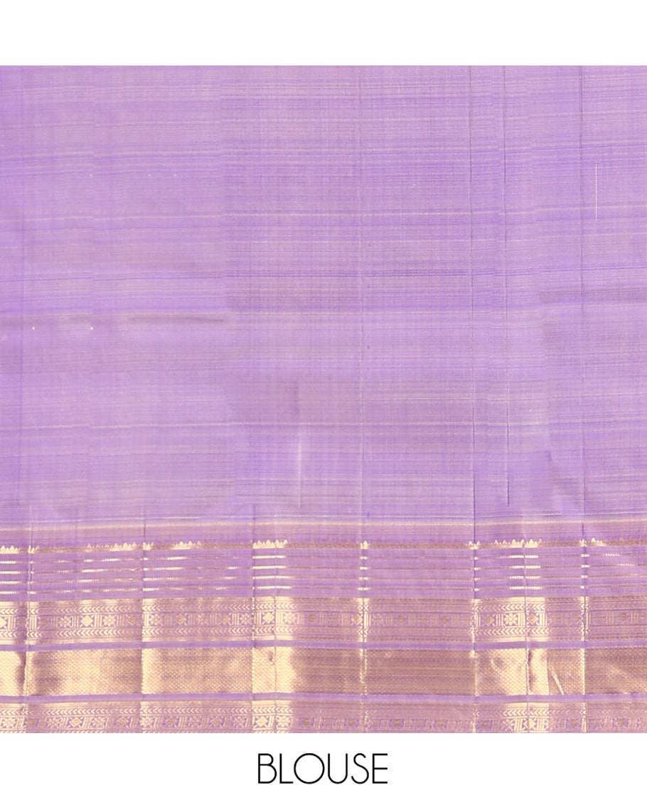 Blue Vasundhara Silk Saree, Adorned with Thilakam and Floral Buttas on Its Body, Complemented by a Contrast Border of Rekku, Muthu, Kathir, Kamalam, Diamond, and Mayil Kann Designs, Pallu Steeped with Intricate Designs, and Paired with a Contrast Blouse