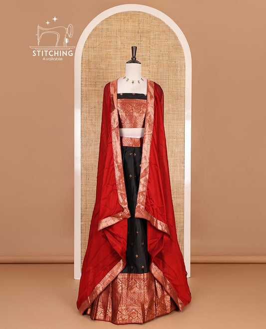 Black taffeta silk half saree, zari buttas with contrast red traditional zari border, matching zari blouse, and contrast plain zari border dhavani