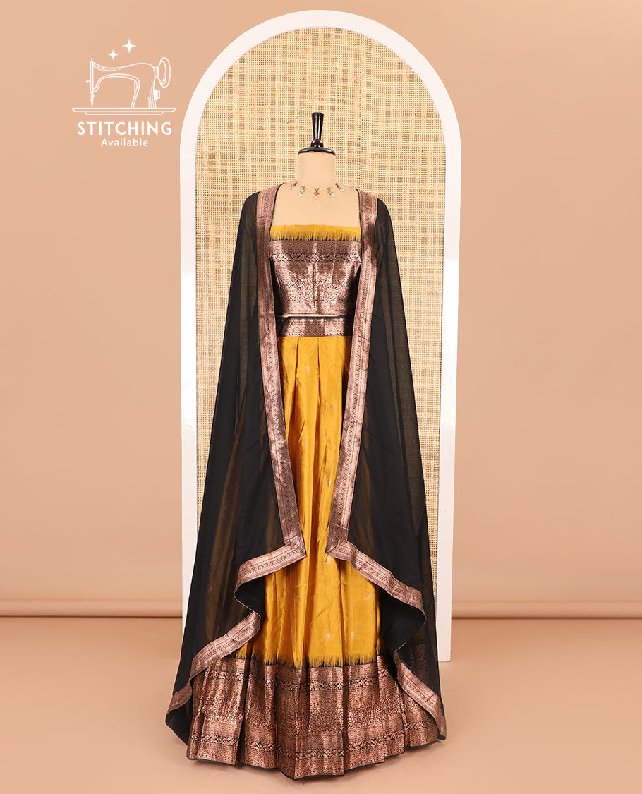 Yellow half-saree, zari buttas with contrast traditional zari bordered skirt, matching blouse and a contrast zari border dhavani