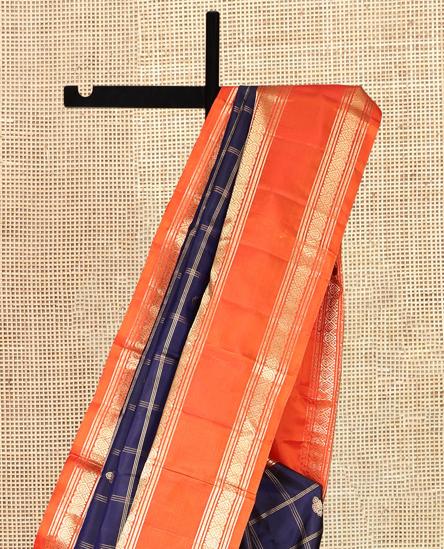 Blue Kanchipuram Silk Saree, Gleamed Up with Butta Enclosed Checks, Complemented by a Contrast Rettai Pettu Zari Border, Grand Pallu, and a Contrast Blouse