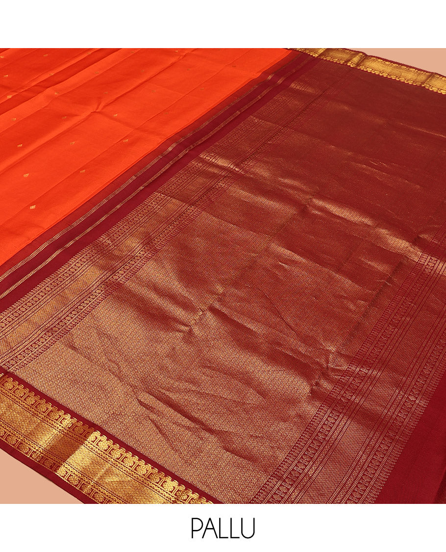 Orange Vasundhara Silk Saree, Enthralled with Zari Buttas All Over Its Body, Complemented by a Contrast Border of Manga, Poun, Neli, and Mayil Kann Designs, Grand Jaal Pallu, and Paired with a Contrast Blouse
