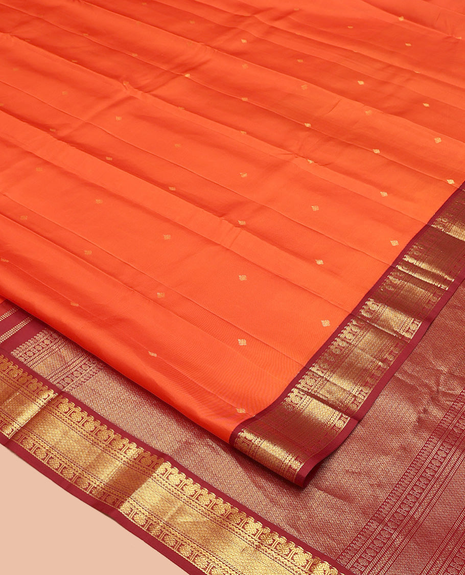 Orange Vasundhara Silk Saree, Enthralled with Zari Buttas All Over Its Body, Complemented by a Contrast Border of Manga, Poun, Neli, and Mayil Kann Designs, Grand Jaal Pallu, and Paired with a Contrast Blouse