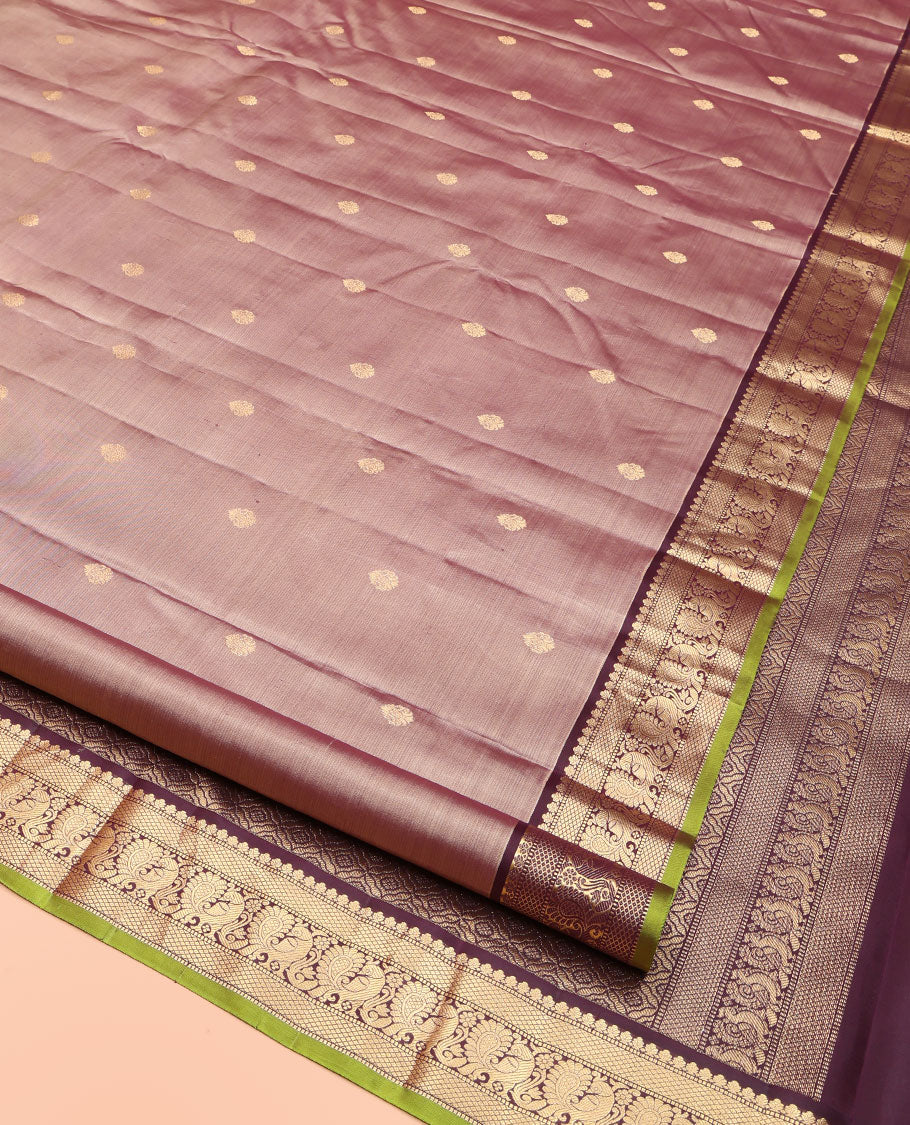 Rose Gold Pink Kanchipuram Silk Saree, Prettified with Zari Buttas All Over Its Body, Complemented by a Contrast Border of Mutthu, Mayil Kann, and Mayil Designs, Grandly Jaal Design Decked Up Pallu, and Paired with a Contrast Blouse