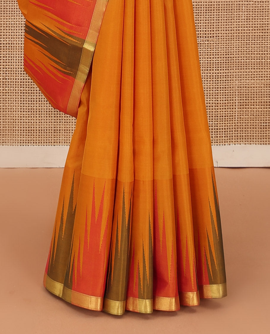 Orange plain Bangalore silk saree, contrast temple zari piping border, and temple design pallu