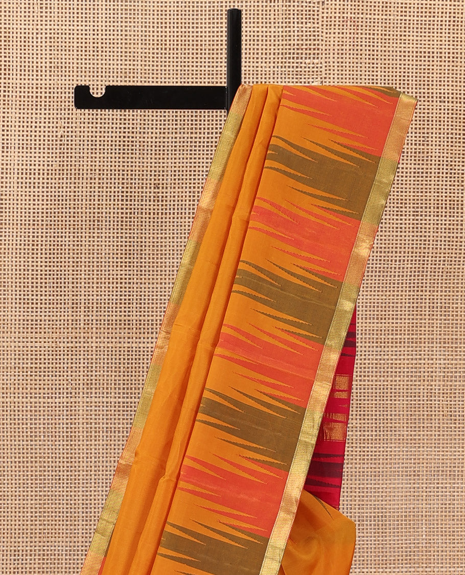 Orange plain Bangalore silk saree, contrast temple zari piping border, and temple design pallu