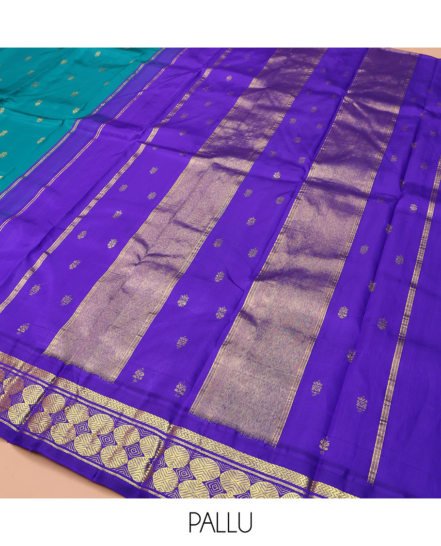 Blue Kanchipuram Silk Saree, Bedecked with Zari Buttas on Its Body, Complemented by a Contrast One-Sided Border of Vanki, Banaras, and Poun Designs, Pallu of Zari Designs, and Comes Without a Blouse
