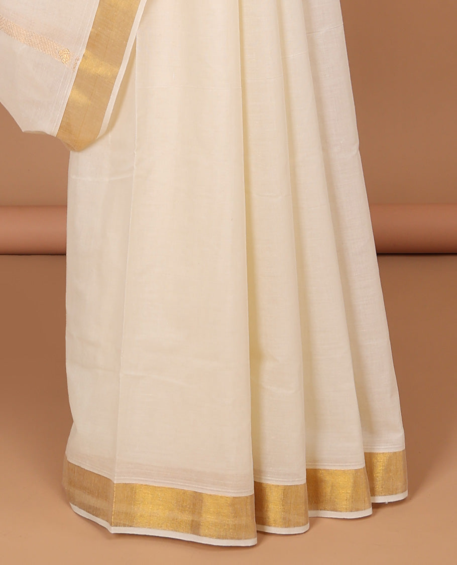 Cream kerala saree with zari designs, zari border & pallu of paisley designs in zari