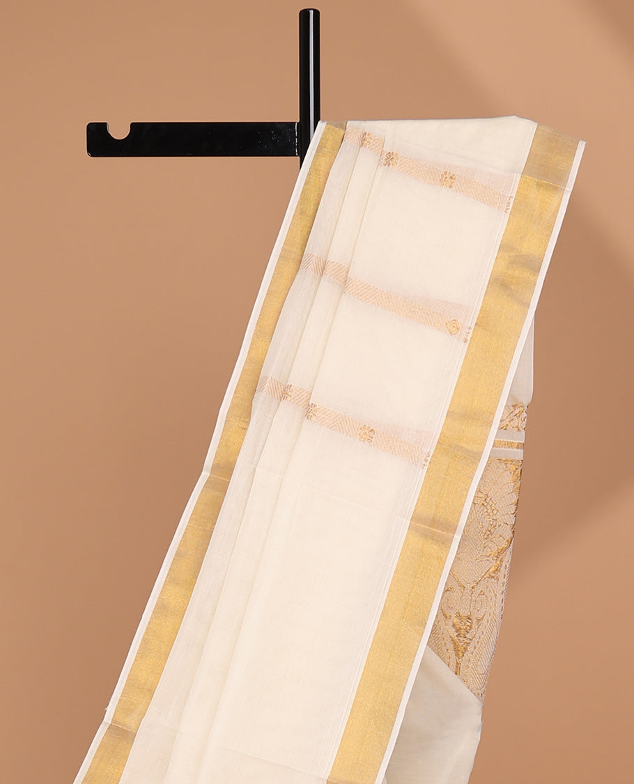 Cream kerala saree with zari designs, zari border & pallu of paisley designs in zari